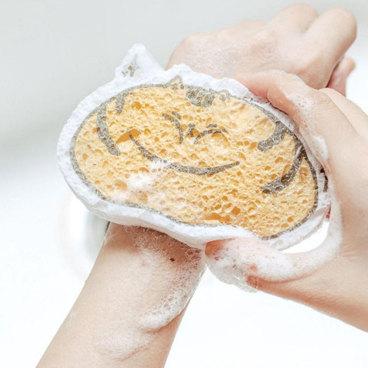 Wukusy 6428a compressed wood pulp sponge with cartoon design, kitchen cleaning scouring pad and absorbing dishwashing tool.