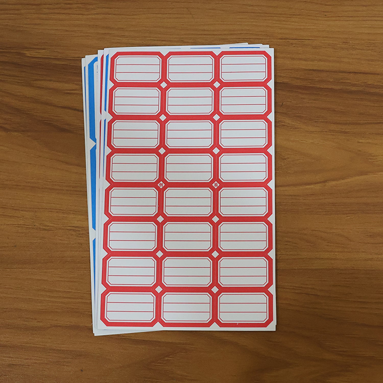 Wukusy multipurpose writable label stickers on five sheets, featuring various sizes and shapes for organizing and labeling.