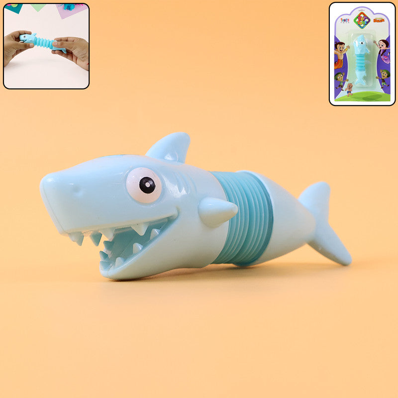 Wukusy shark-shaped magic spring toy coiled and ready for play, featuring a colorful, detailed shark design on a white background.