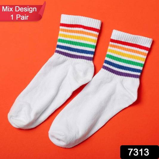Pair of Wukusy trendy designer socks with colorful printed and mixed patterns on a white background.