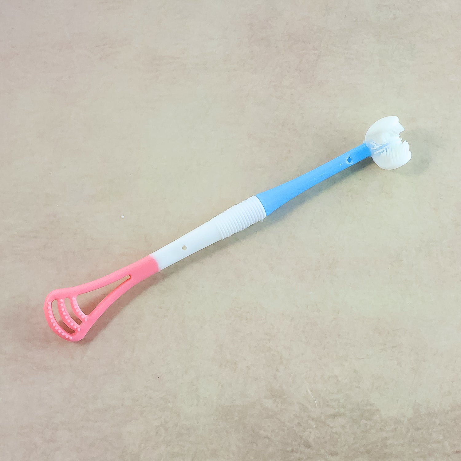 Wukusy 2-in-1 baby tongue cleaner and oral massager stick with soft silicone brush head for gentle baby oral care.