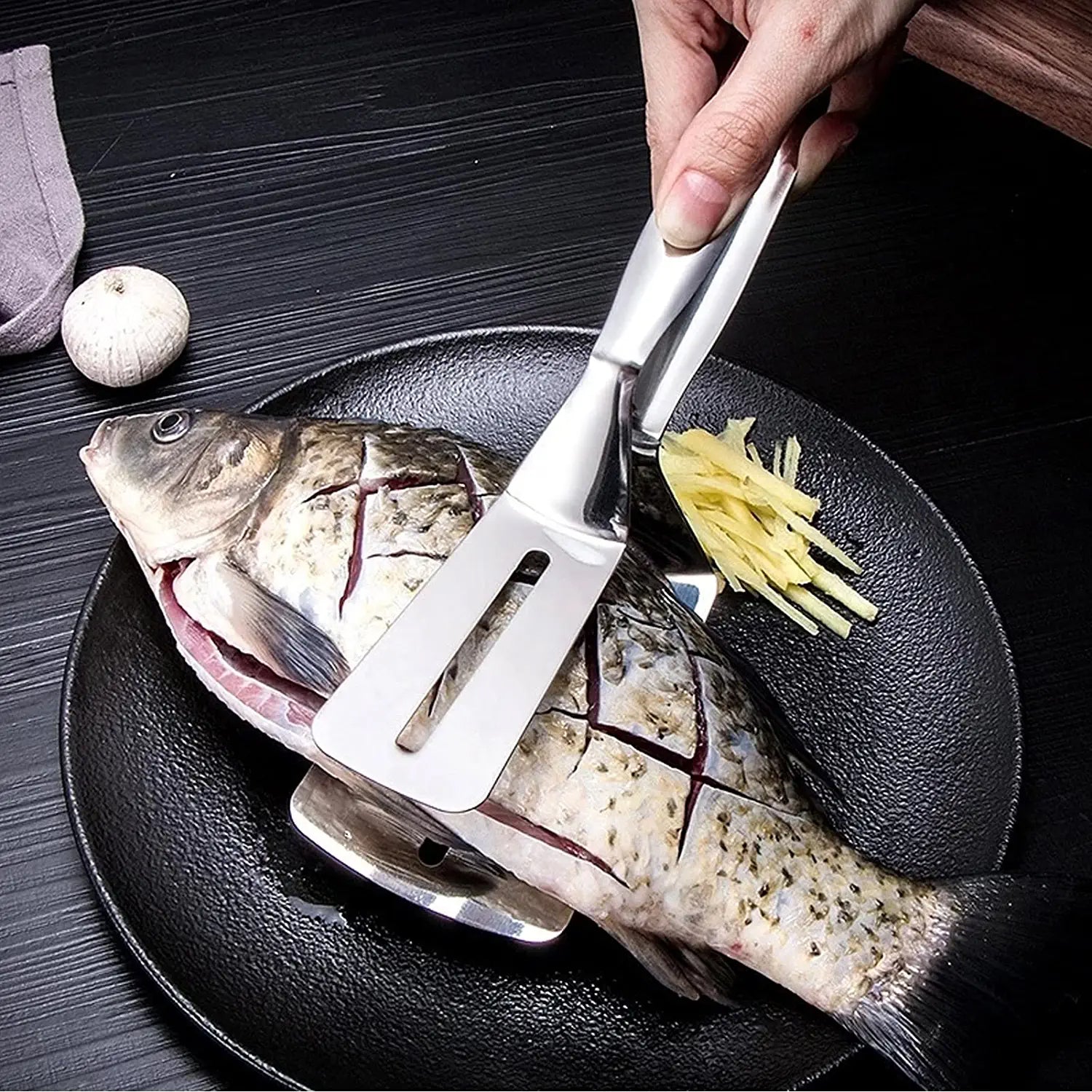 Wukusy 2918 multifunction kitchen tong with stainless steel handle, ideal for flipping, serving, and grilling food like steaks and BBQ.