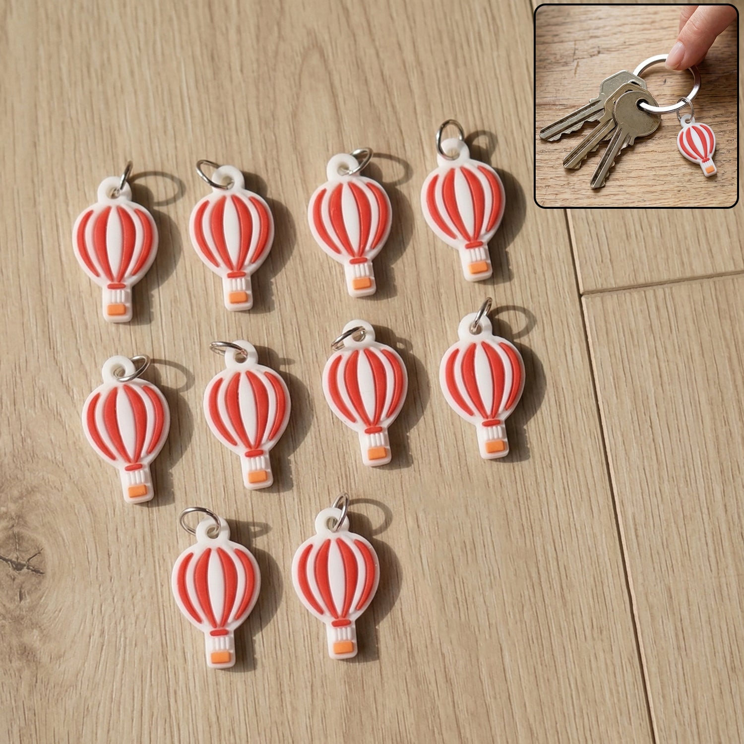 Set of 10 Wukusy hot air balloon bag charm keychains featuring colorful miniature hot air balloon designs.