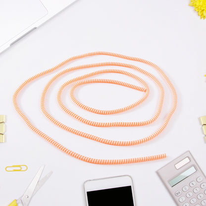 Flexible spiral cable protector sleeve by Wukusy with black color, shown wrapped around a cable for protection and organization.