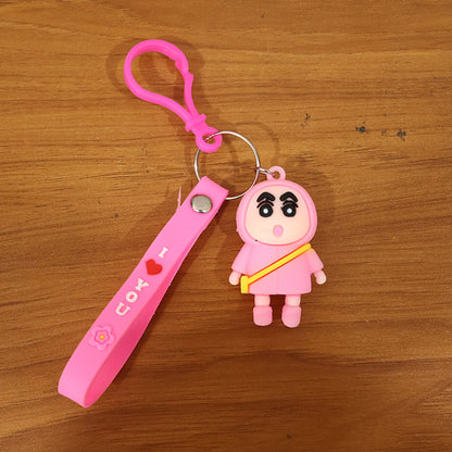 Cute cartoon doll figure keychain by Wukusy featuring a colorful, playful design with a smiling character and a metal keyring.