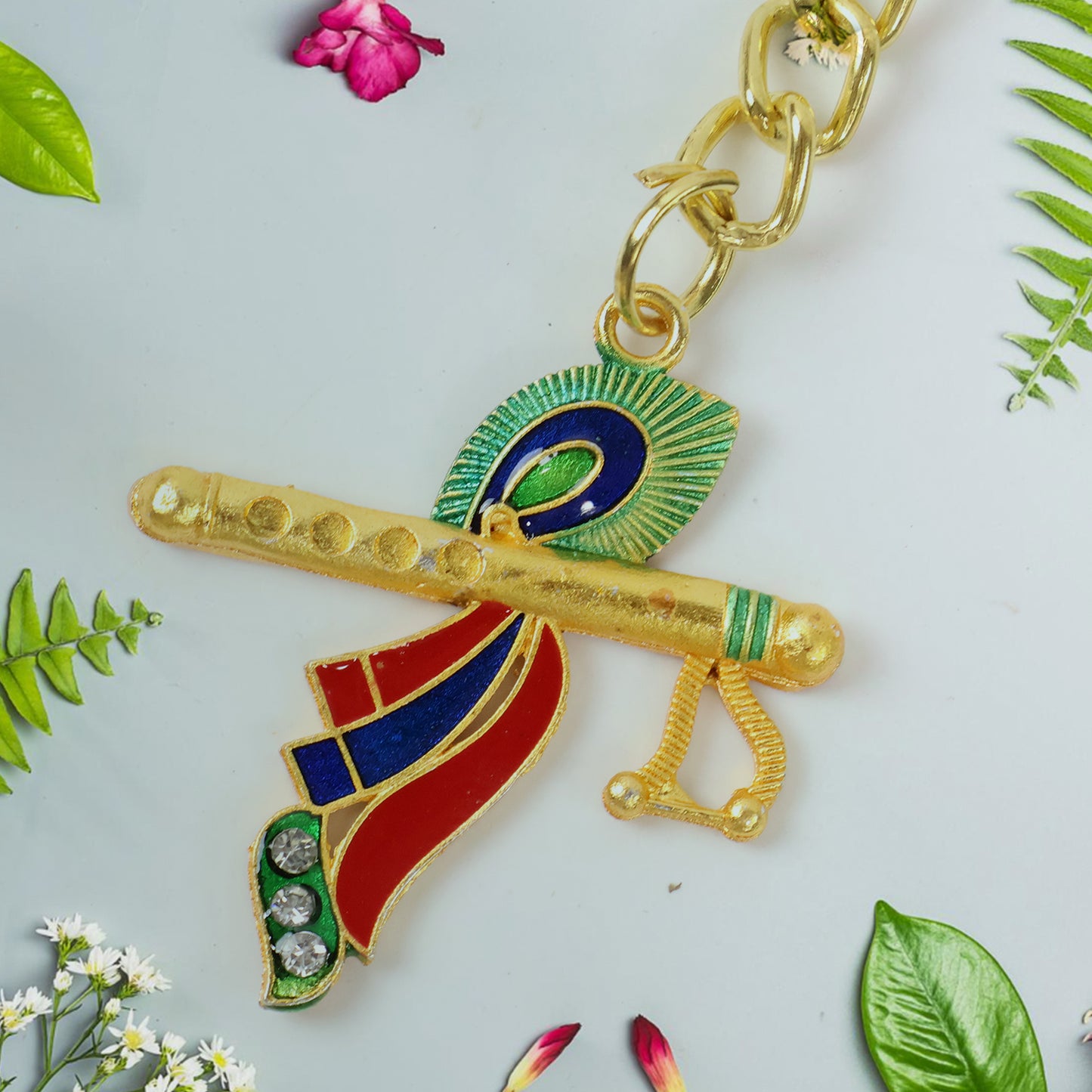Wukusy Krishna flute with peacock feather design keychain, detailed miniature musical instrument with intricate artwork.