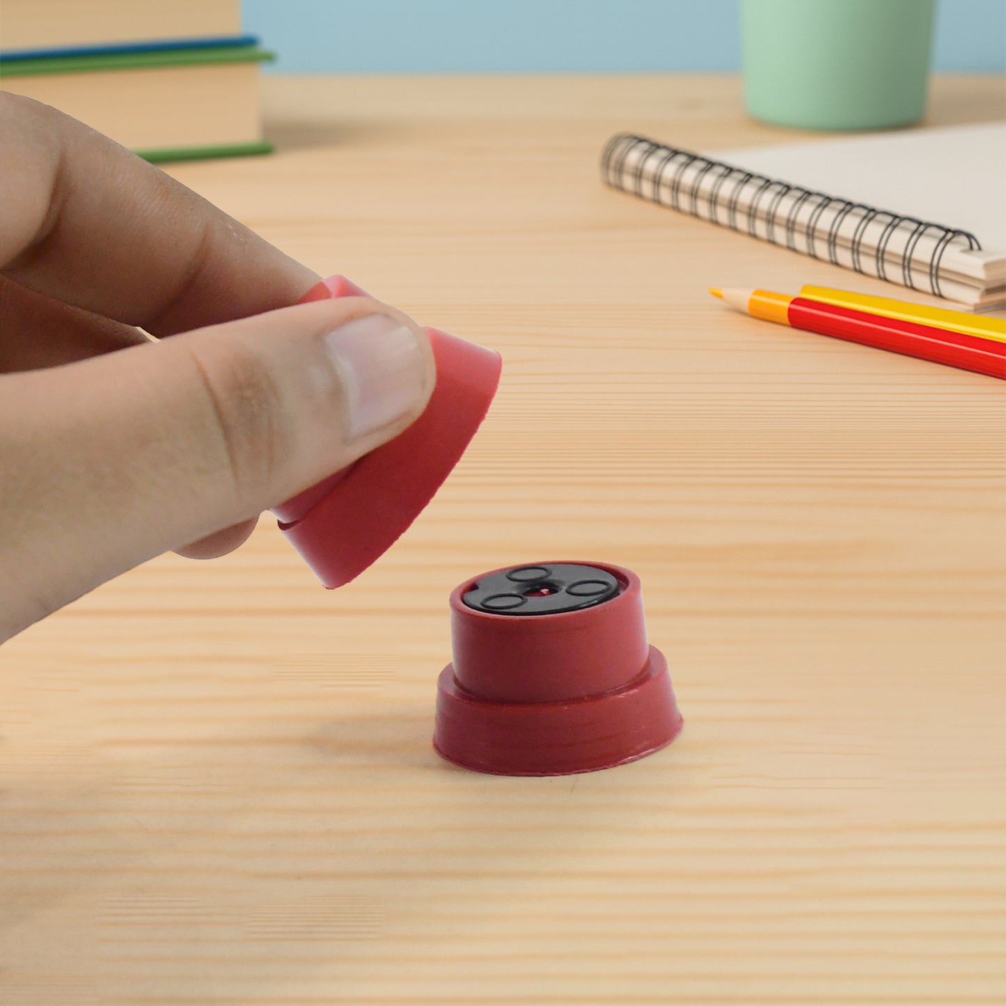 Wukusy Magic Coin Pedestal toy set for kids showcasing a fun illusion trick with a coin and pedestal in vibrant colors.