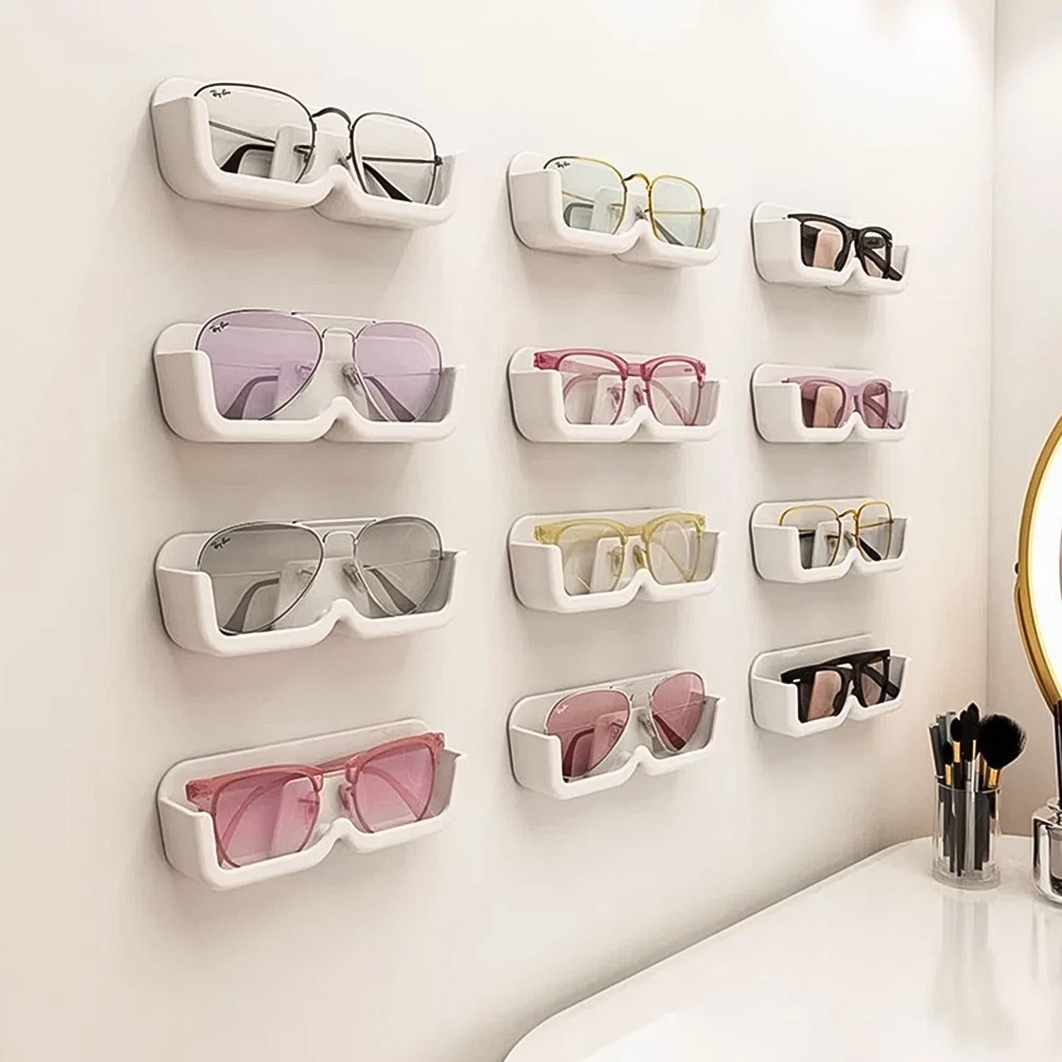 Wukusy wall mount adhesive sunglass holder, single black plastic clip with adhesive backing for organizing sunglasses on wall.