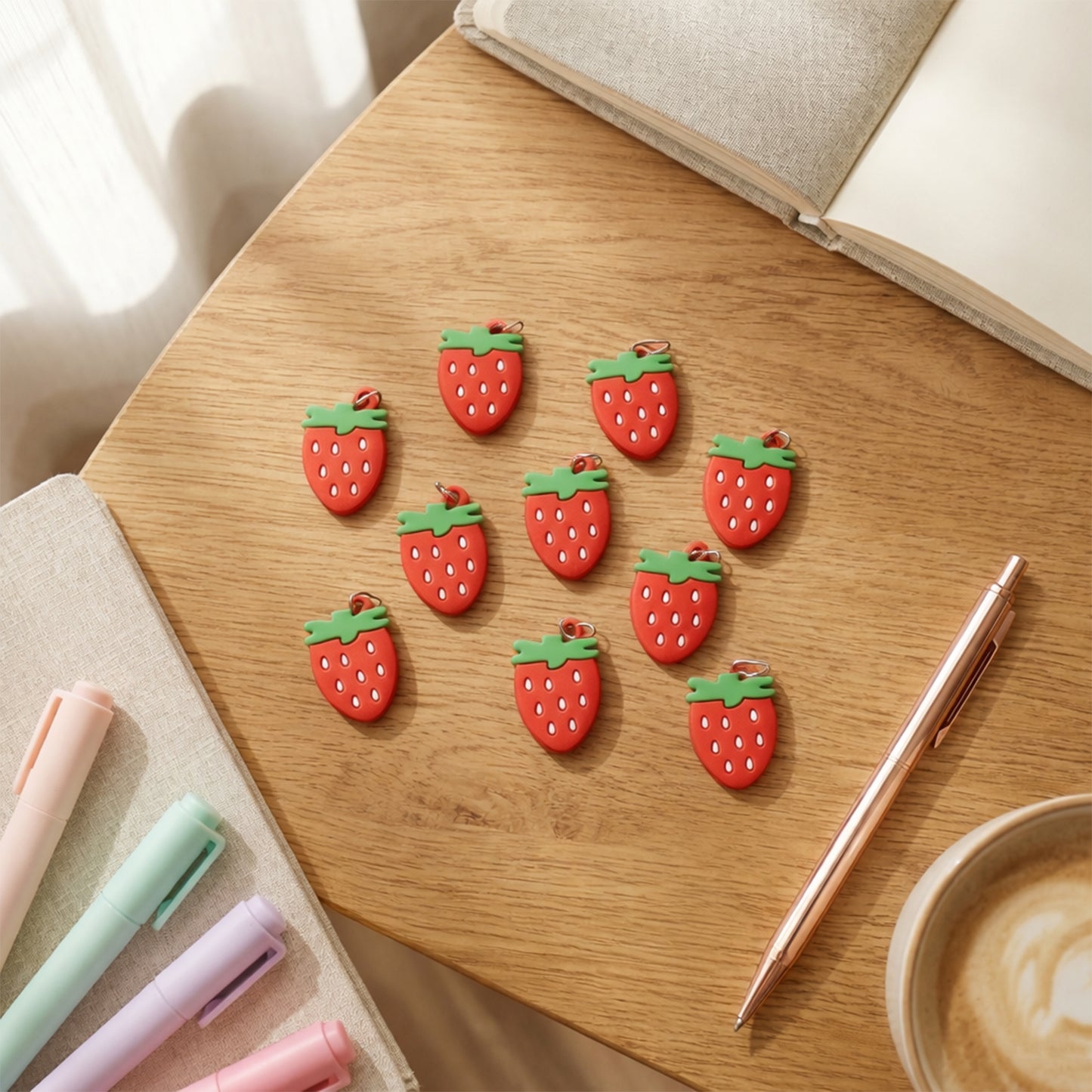 Set of 10 Wukusy strawberry design bag charm keychains with colorful, playful fruit motifs for bags and accessories.
