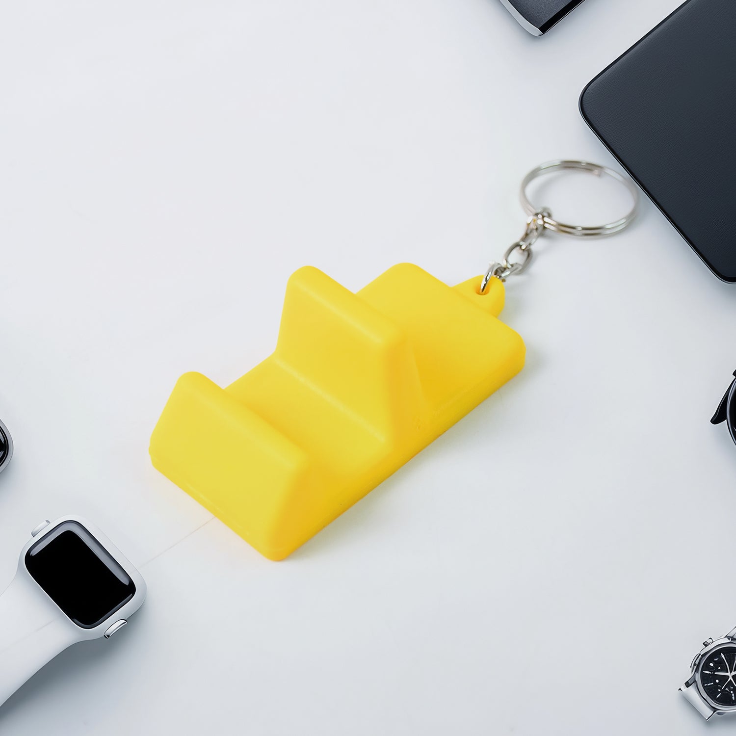 Wukusy plastic 2-in-1 mobile stand keychain showcasing a compact, portable accessory with a built-in phone stand and keyring.