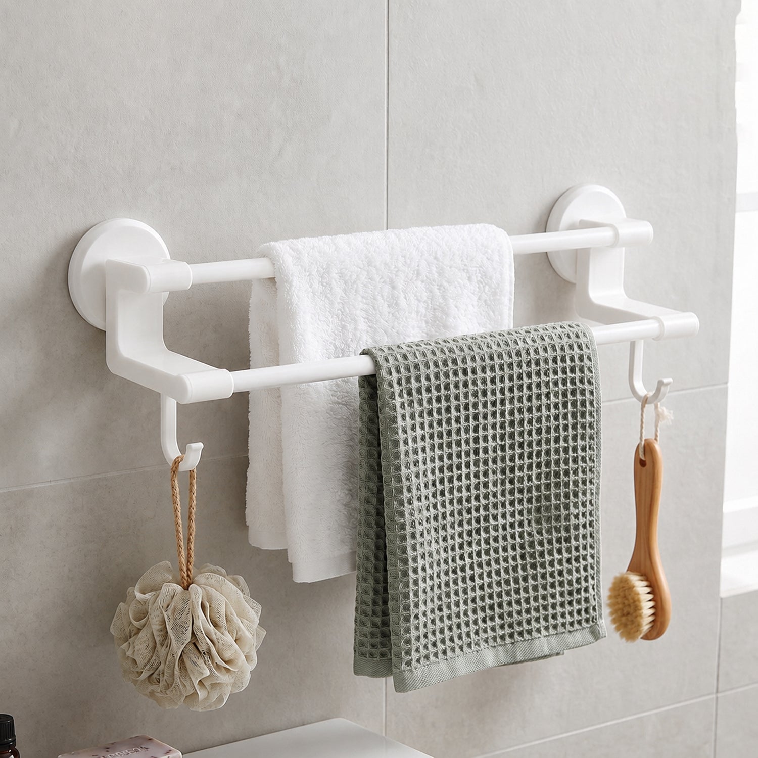 Wall-mounted Wukusy double bar towel holder rack with side hooks, shown with towels and accessories on the brushed metal finish.