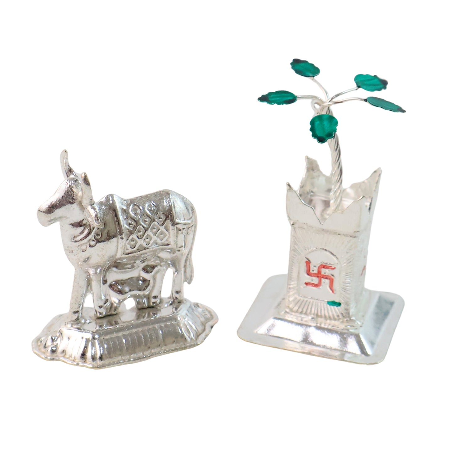 Silver-plated Kamdhenu Cow and Tulsi plant pair for pooja and home decor, crafted by Wukusy, displayed with traditional ornaments.
