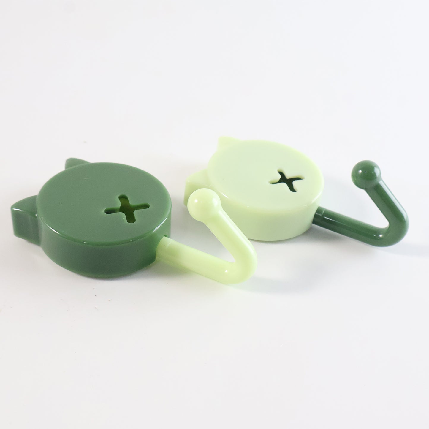 Set of 10 Wukusy self-adhesive round wall hooks mounted on a wall for home organization and hanging items.