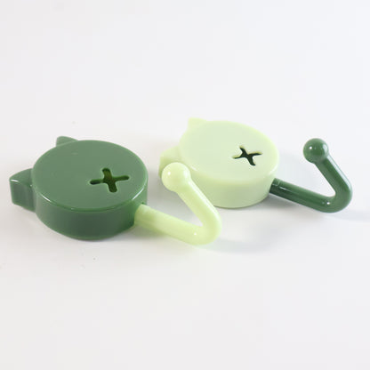 Set of 10 Wukusy self-adhesive round wall hooks mounted on a wall for home organization and hanging items.