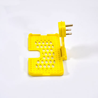 Yellow Wukusy 6498 multi-purpose wall holder stand for mobile charging, fits in socket and hangs phones securely.
