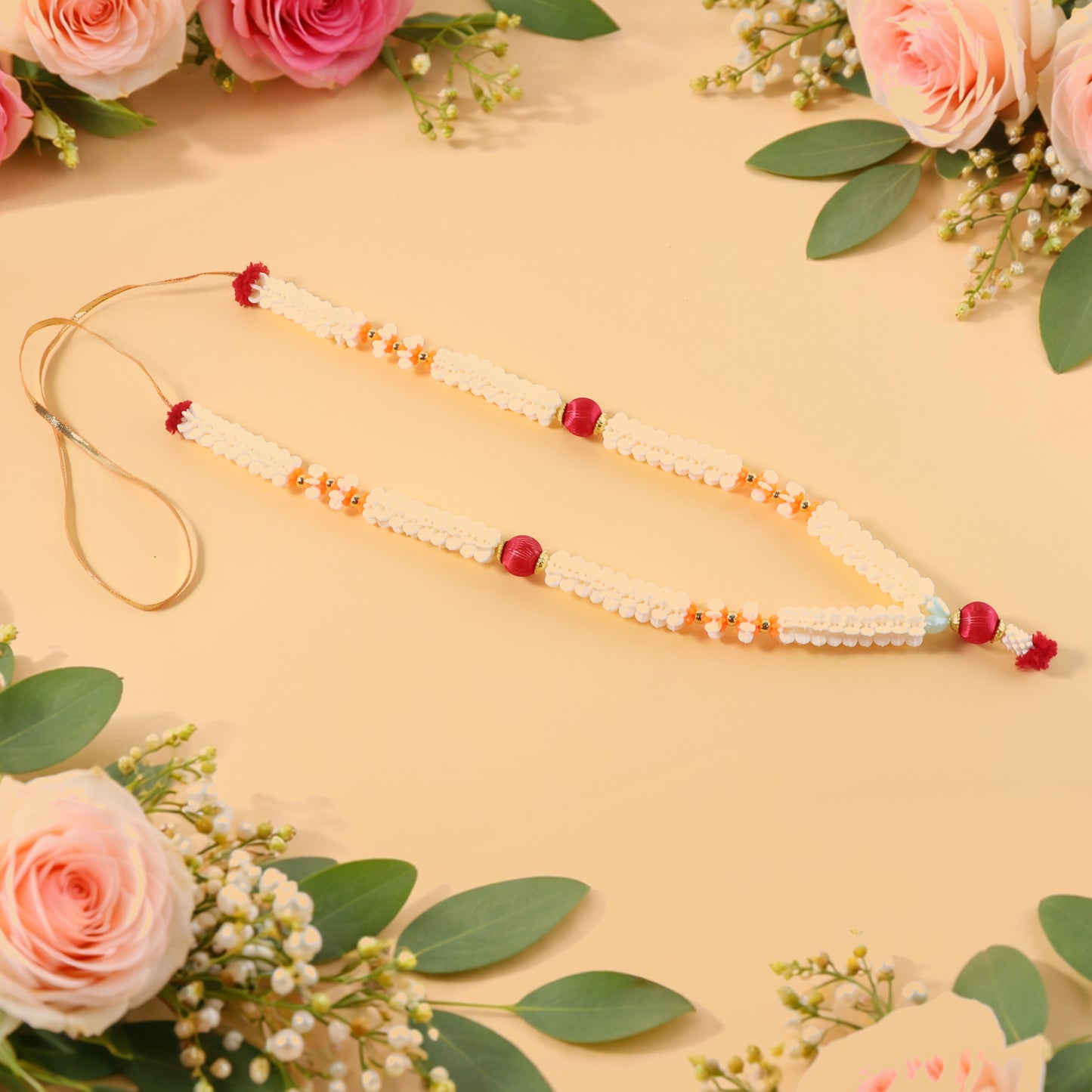 Traditional decorative Pooja Gajra garland by Wukusy, showcasing colorful floral design for religious ceremonies.
