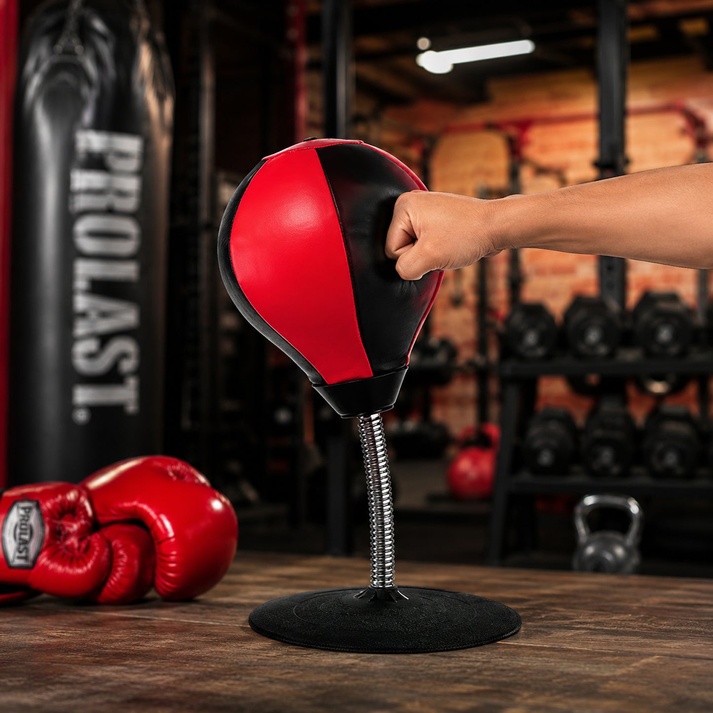 Wukusy inflatable desktop punching bag with air pump, compact punching toy for stress relief and fun at work or home.