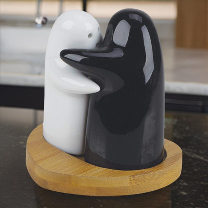 Set of two Wukusy ceramic salt and pepper shakers with cute spice shaker designs for seasoning.