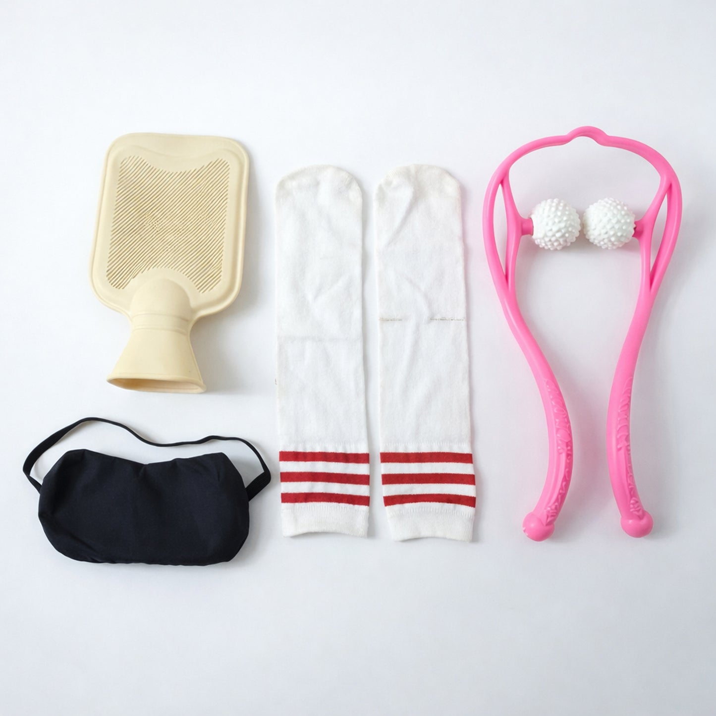 Wukusy self-care and relaxation combo set including candles, essential oils, and spa accessories on a wooden surface.