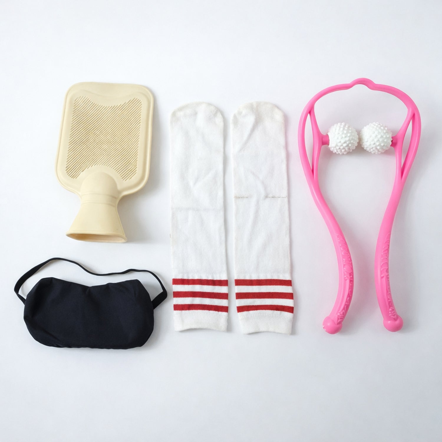 Wukusy self-care and relaxation combo set including candles, essential oils, and spa accessories on a wooden surface.