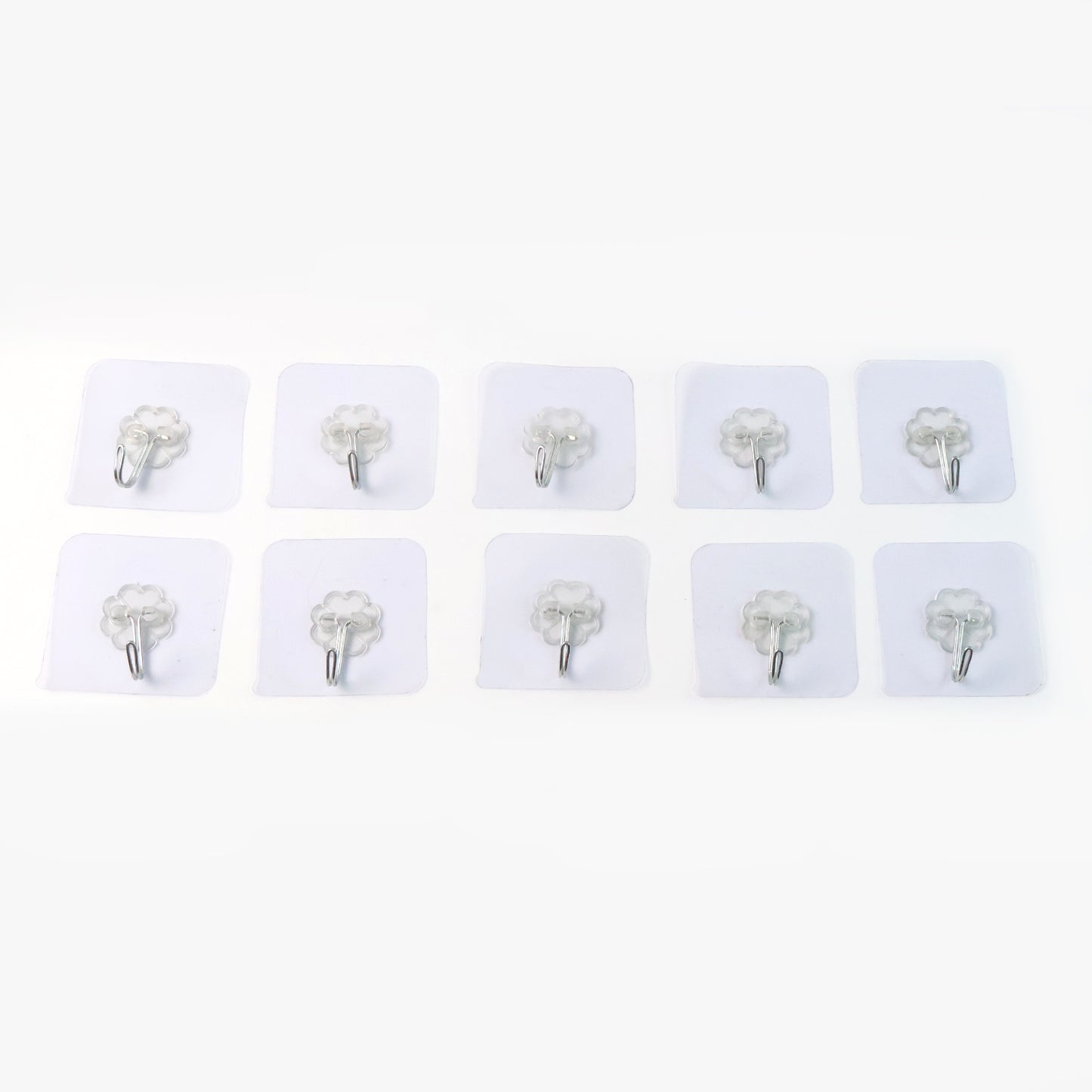 Set of 10 heavy-duty Wukusy flower adhesive wall hooks mounted on a wall for home organization and decor.