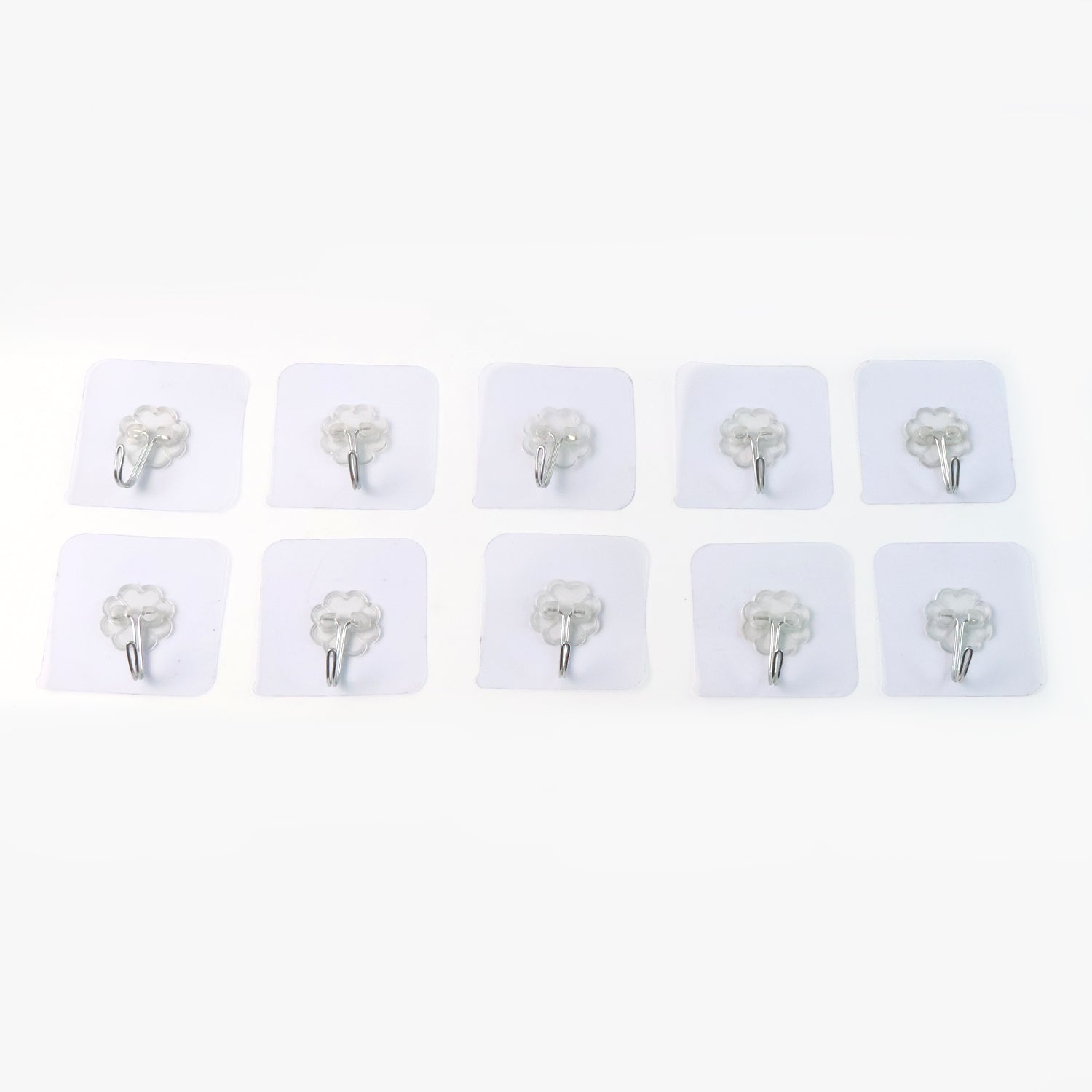 Set of 10 heavy-duty Wukusy flower adhesive wall hooks mounted on a wall for home organization and decor.