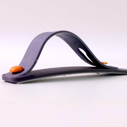 Dark grey silicone phone loop finger holder grip strap by Wukusy, showing a close-up of the strap attached to a smartphone.