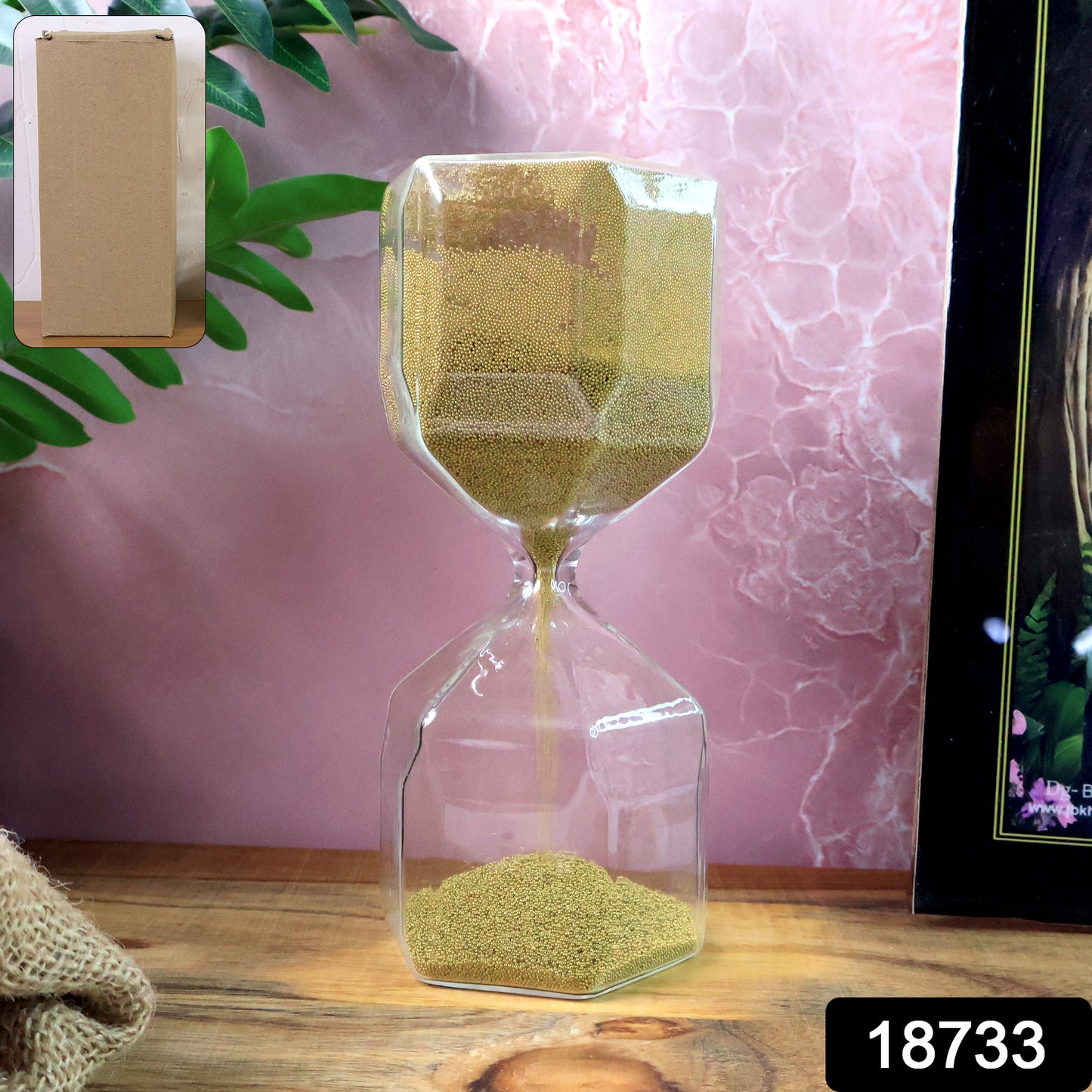 Faceted glass hourglass sand timer by Wukusy showing a 4-minute countdown, suitable for office use.