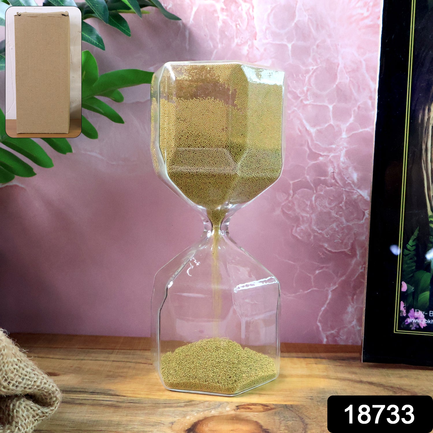 Faceted glass hourglass sand timer by Wukusy showing a 4-minute countdown, suitable for office use.