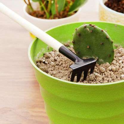 Wukusy kids garden tools set with a trowel, shovel, and rake, perfect for young children’s outdoor gardening play.