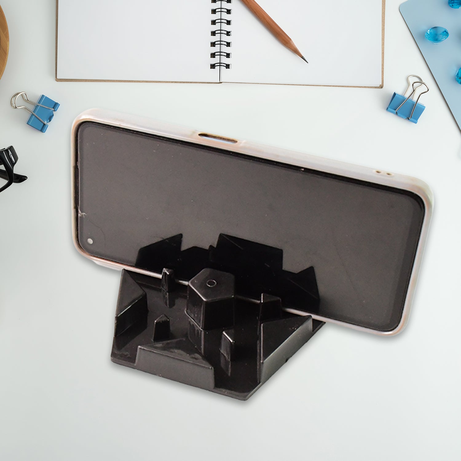 Two Wukusy multi-angle plastic mobile phone stand holders in mixed colors, showing different viewing angles and adjustable features.