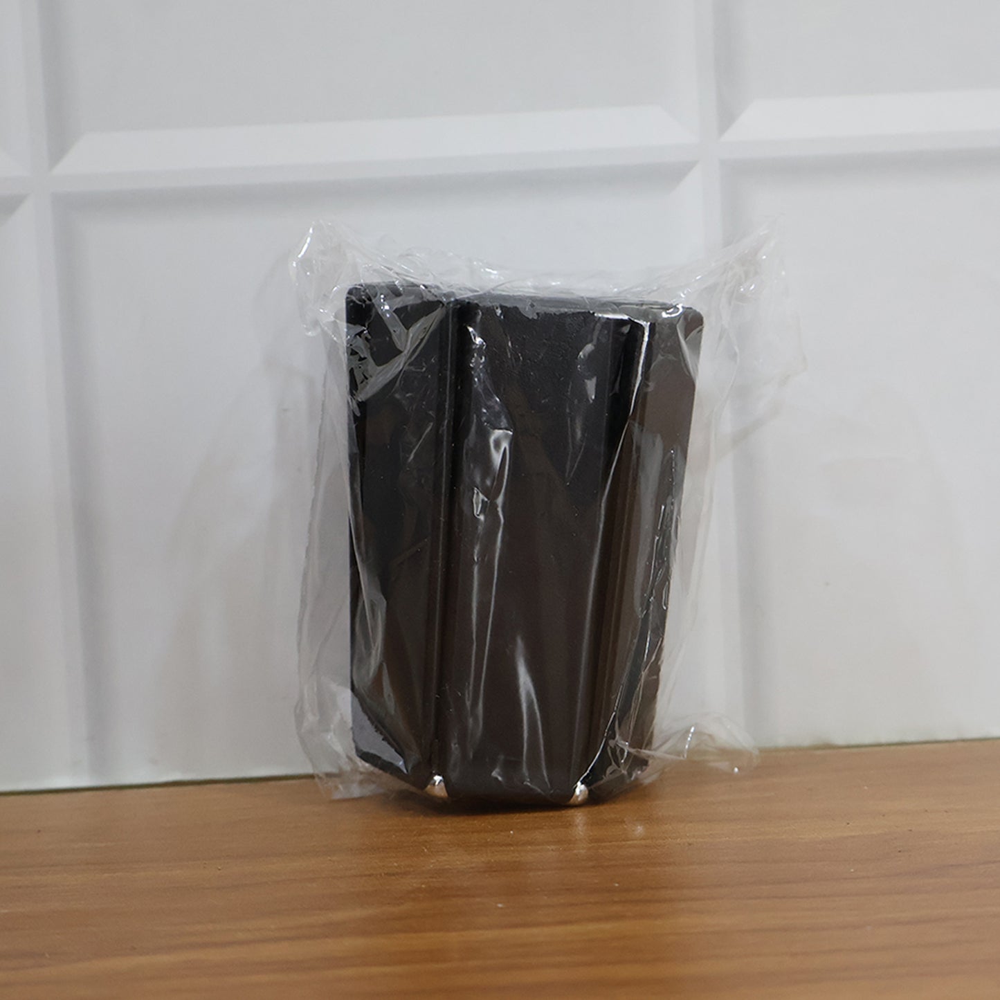 Foldable insulated trivet mat by Wukusy for hot pots, heat-resistant and portable for kitchen use, shown in a home setting.