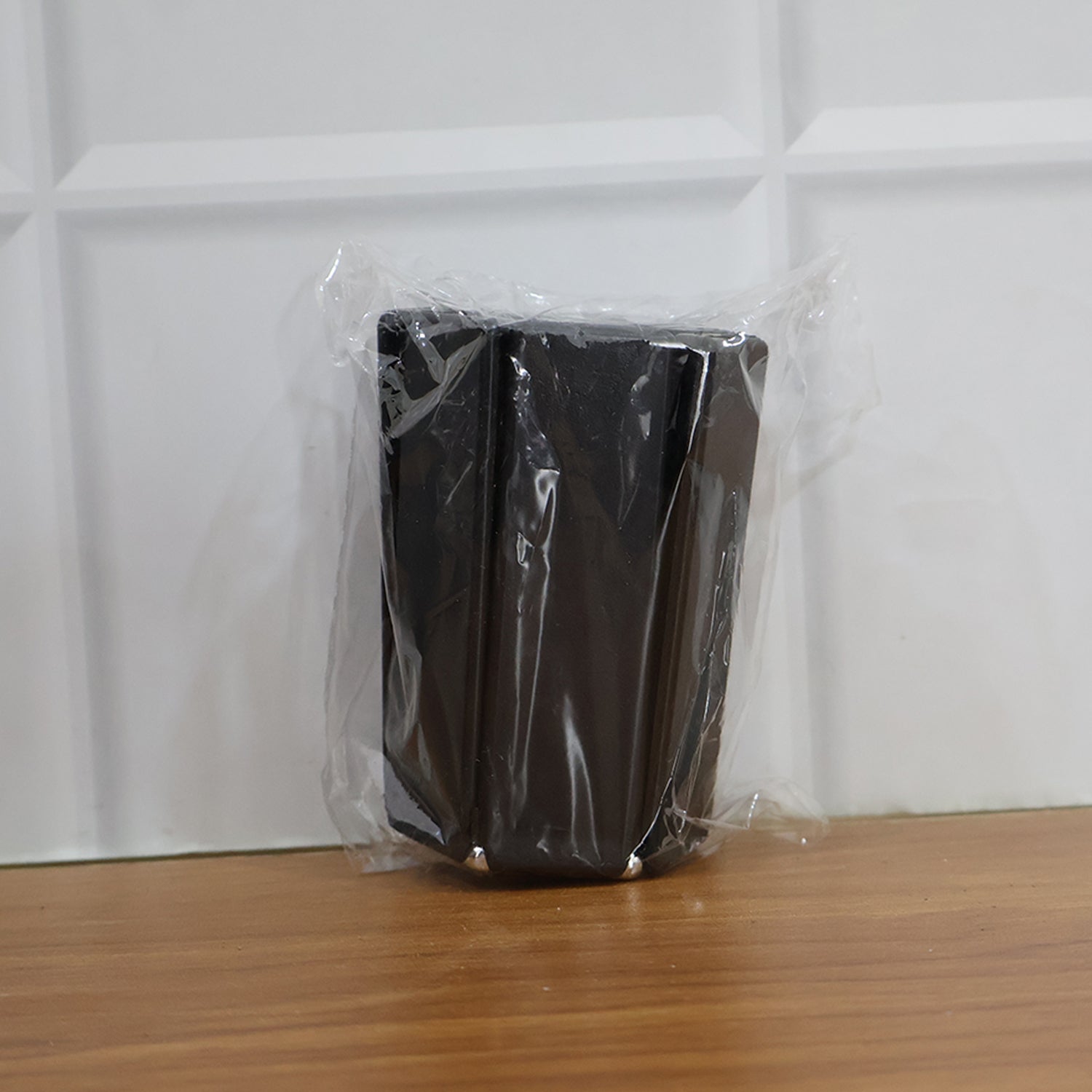 Foldable insulated trivet mat by Wukusy for hot pots, heat-resistant and portable for kitchen use, shown in a home setting.