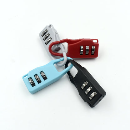 Wukusy 6109 3-digit luggage lock with key and tool, used for securing baggage and travel items.