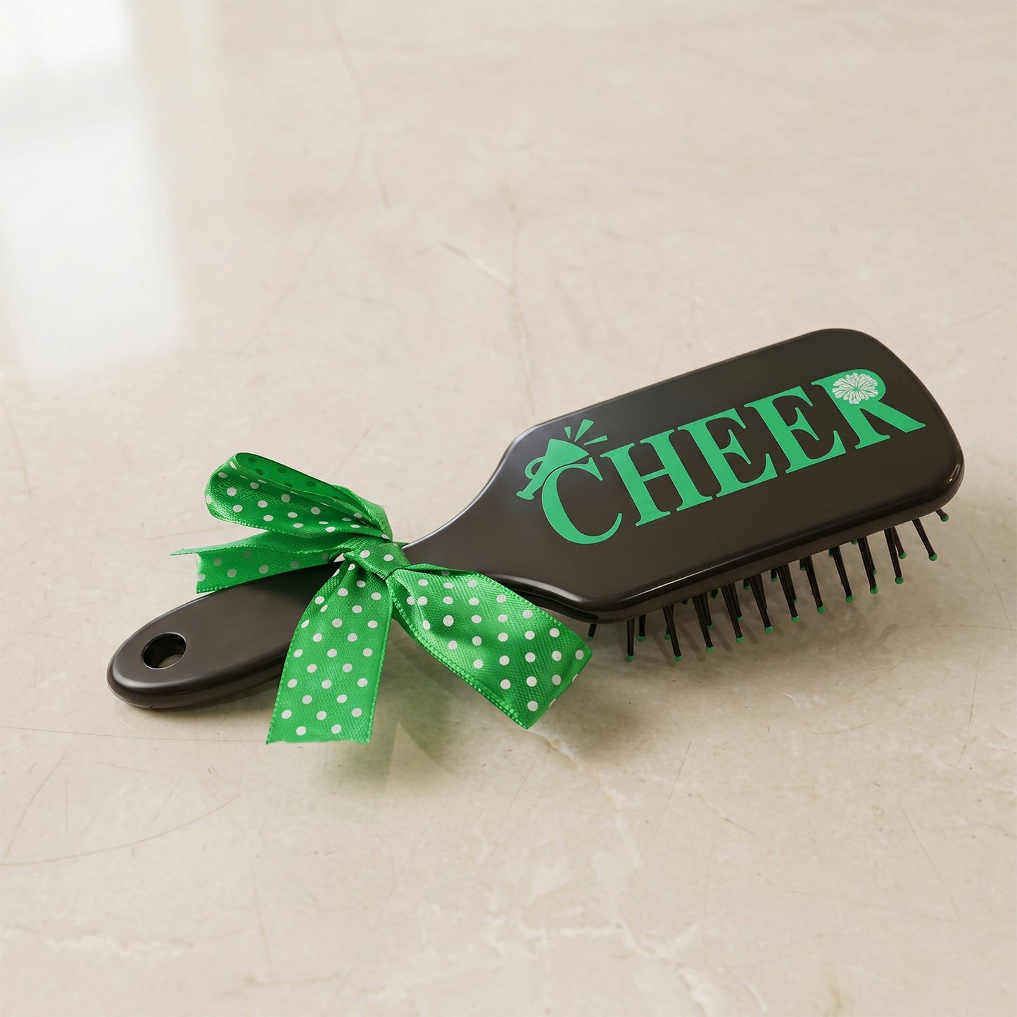 Kids printed hair brush by Wukusy with a cute ribbon bow handle, designed for detangling children's hair.