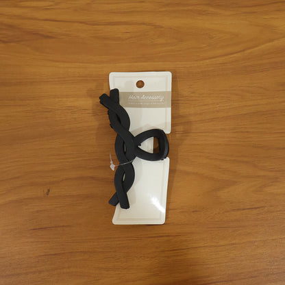 Wukusy stylish twist design hair claw clip holding hair in a natural updo, made of durable plastic with a sleek finish