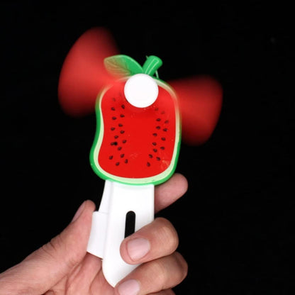 Mini Wukusy hand pressure fruit-shaped fan for kids, featuring colorful fruit designs and compact handheld style.