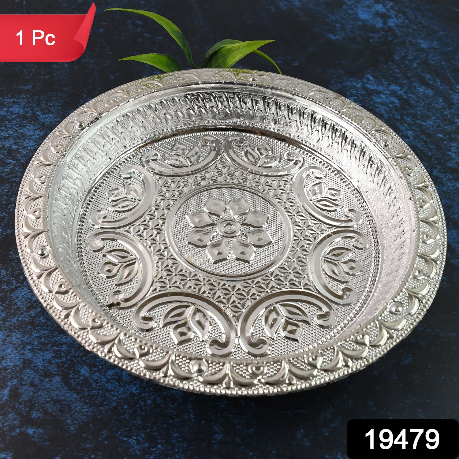 Traditional silver finish plastic pooja thali for home prayer rituals, featuring intricate designs and including a small bowl and diya holder.