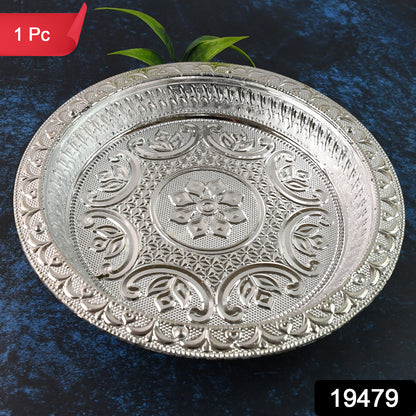 Traditional silver finish plastic pooja thali for home prayer rituals, featuring intricate designs and including a small bowl and diya holder.