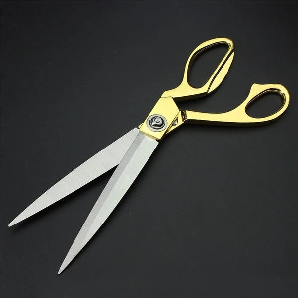 Golden stainless steel tailoring scissors for fabric cutting, professional quality, with sharp blades, ideal for home improvement projects.