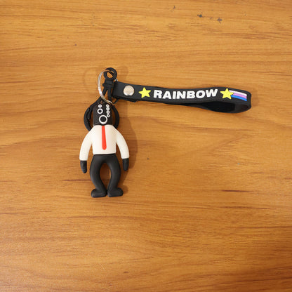 Cartoon man figure keychain by Wukusy, featuring a playful, colorful character design on a metal keyring.