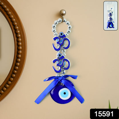 Decorative double Om symbol evil eye hanging with intricate design, made by Wukusy, featuring traditional blue and white colors for protection.