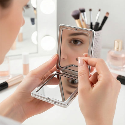 Wukusy foldable mirror keychain featuring a compact, portable design with a reflective surface, ideal for on-the-go use.