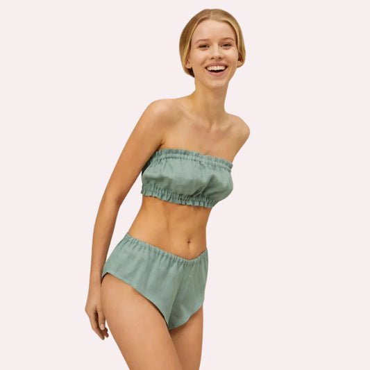 French Daina organic cotton ruffled bandeau top and vintage-style knickers set by Snazzyway, featuring soft fabric and delicate ruffles.