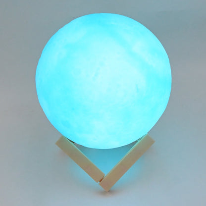 Blue moon night lamp by Wukusy with plastic stand, 15x12 cm, perfect for home decor and ambient lighting.