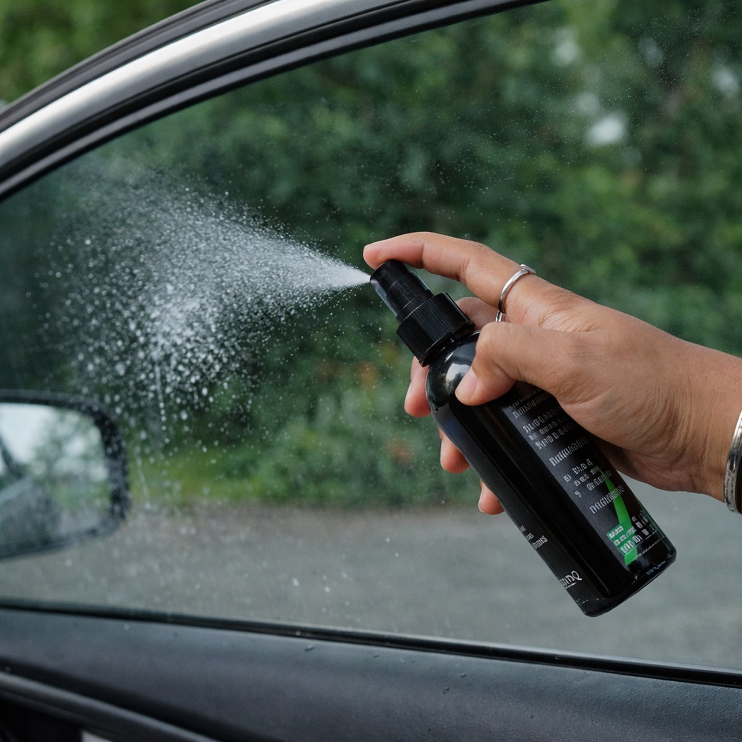 Wukusy anti-fog glass spray for cars and home, 1-piece bottle with spray nozzle on clear glass surface.
