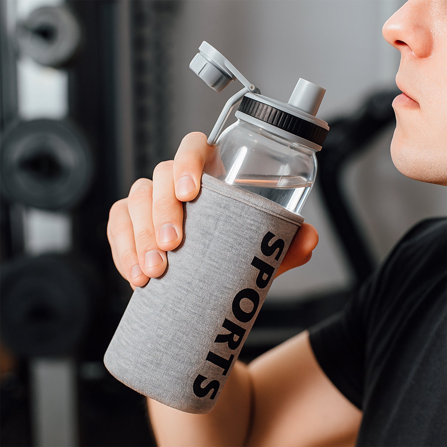 Wukusy 700ml sports water bottle with protective sleeve, features a sleek design for active hydration and durability.