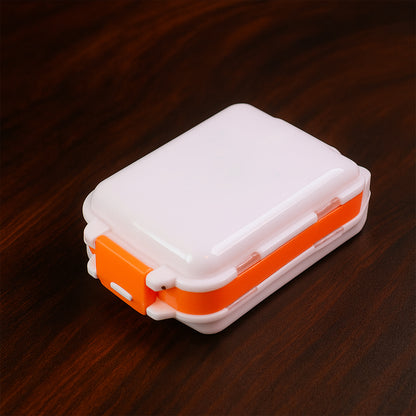 Wukusy portable dual-sided pill organizer box with multiple compartments for daily medication storage, compact and travel-friendly.