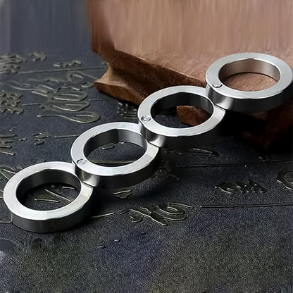 Portable Wukusy 4-finger rotating folding travel ring set displayed with open and closed positions on a white background.