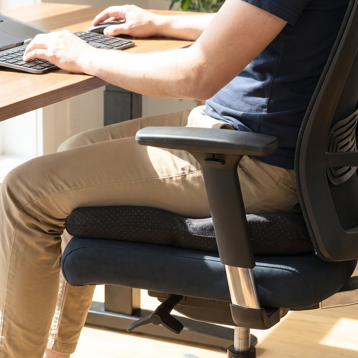 Wukusy ergonomic egg-shaped memory foam chair cushion for office and car seats, providing comfort and support.